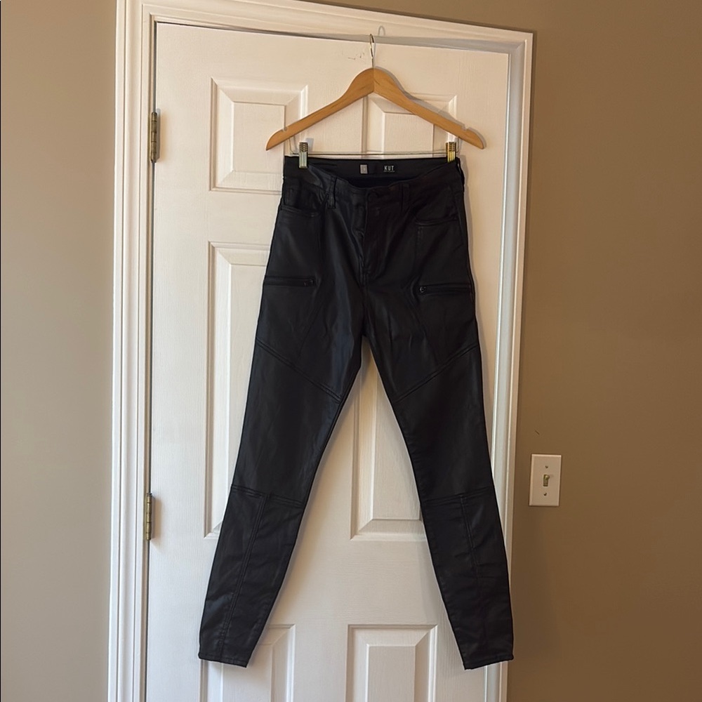 Moto-detailed coated denim jeans